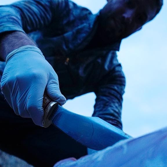 Handmade knife being used outdoors