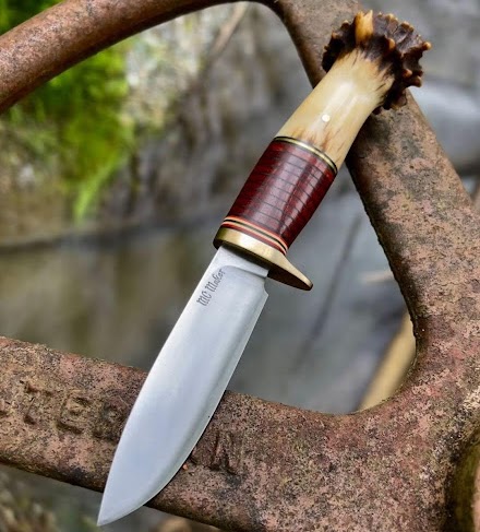 Antler handled handmade knife outdoors