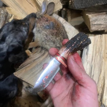 Handmade knife used outdoors in a hunting setting