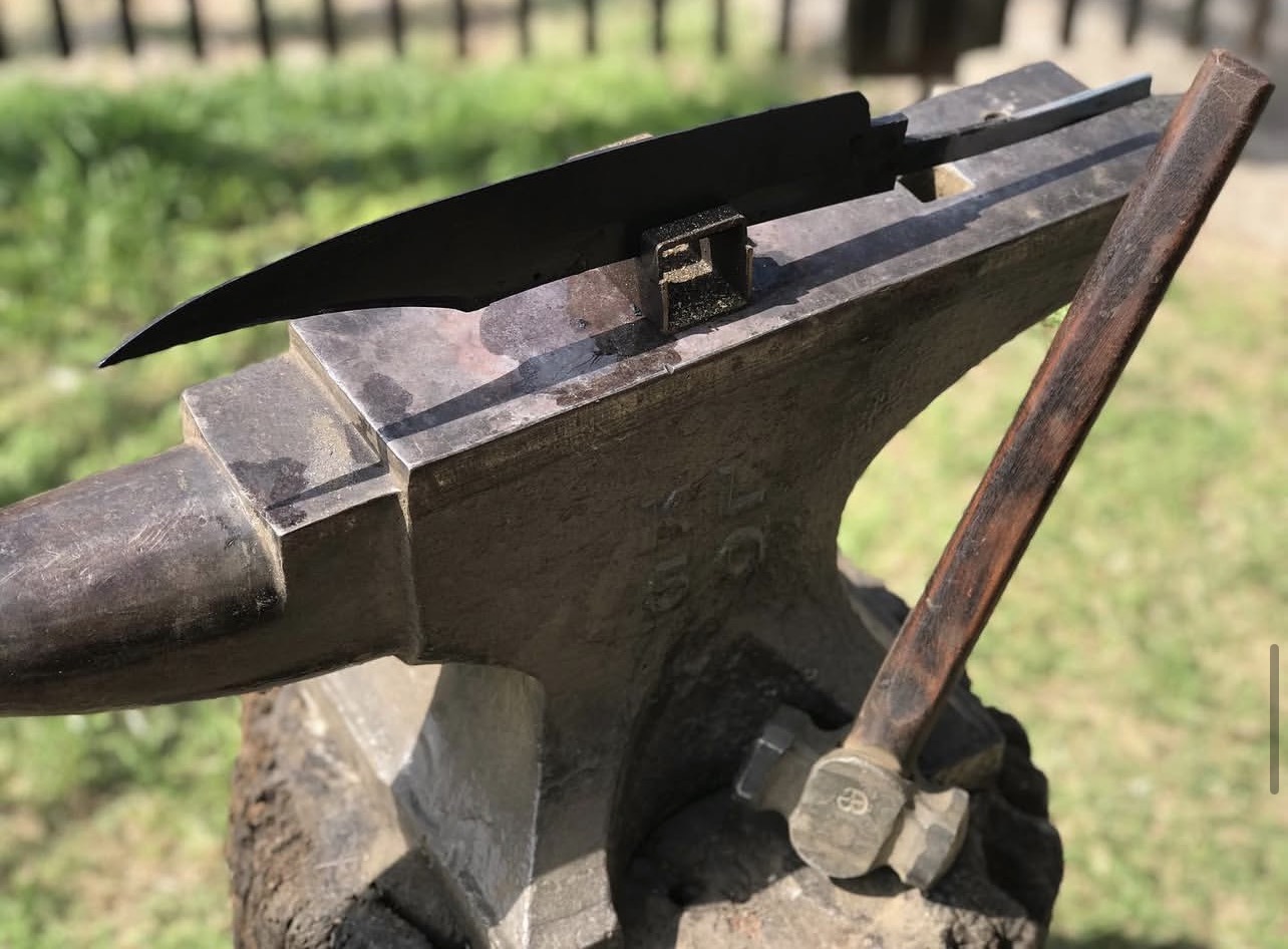 Knife blade being forged on an anvil