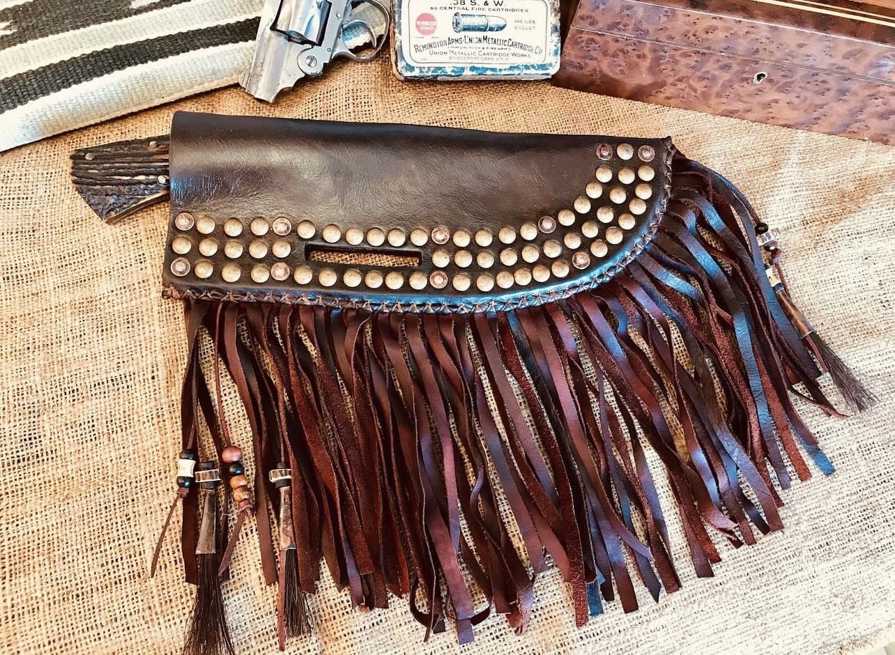 MC Knifemaker handmade knife with handcrafted leather sheath and fringe detailing